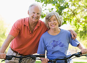 Photo of a man and woman on bicycles. Link to Life Stage Gift Planner Ages 60-70 Situations.
